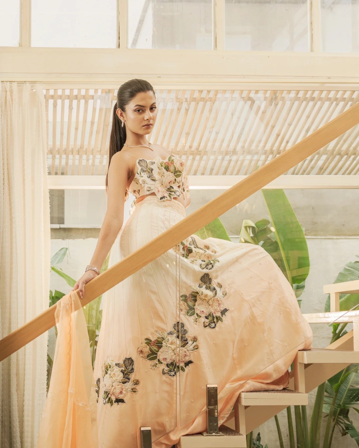 Floral-era lehenga style with 3D floral effect, orange dupatta with floral patch work