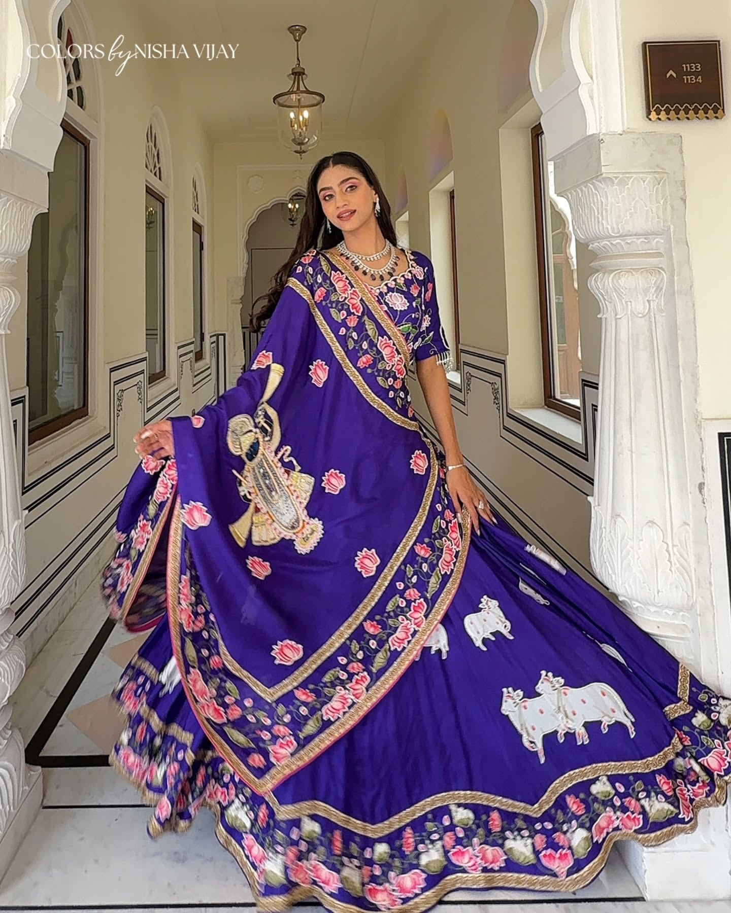 Pichwai-theme lehenga with Shrinathji figure motif; cow print on lehenga