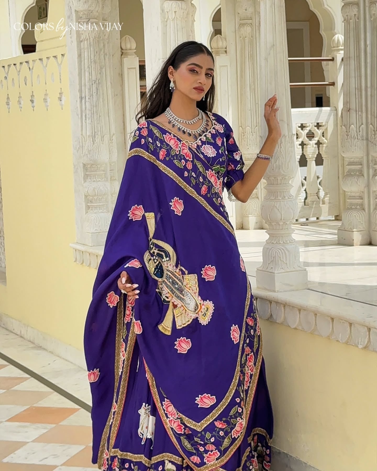 Pichwai-theme lehenga with Shrinathji figure motif; cow print on lehenga