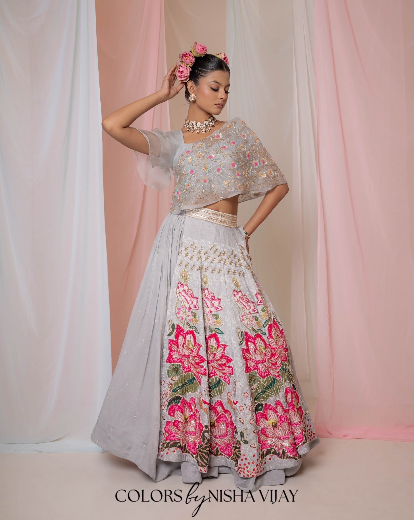 Lotus-print double-layer lehenga with orange cap-style frill blouse
