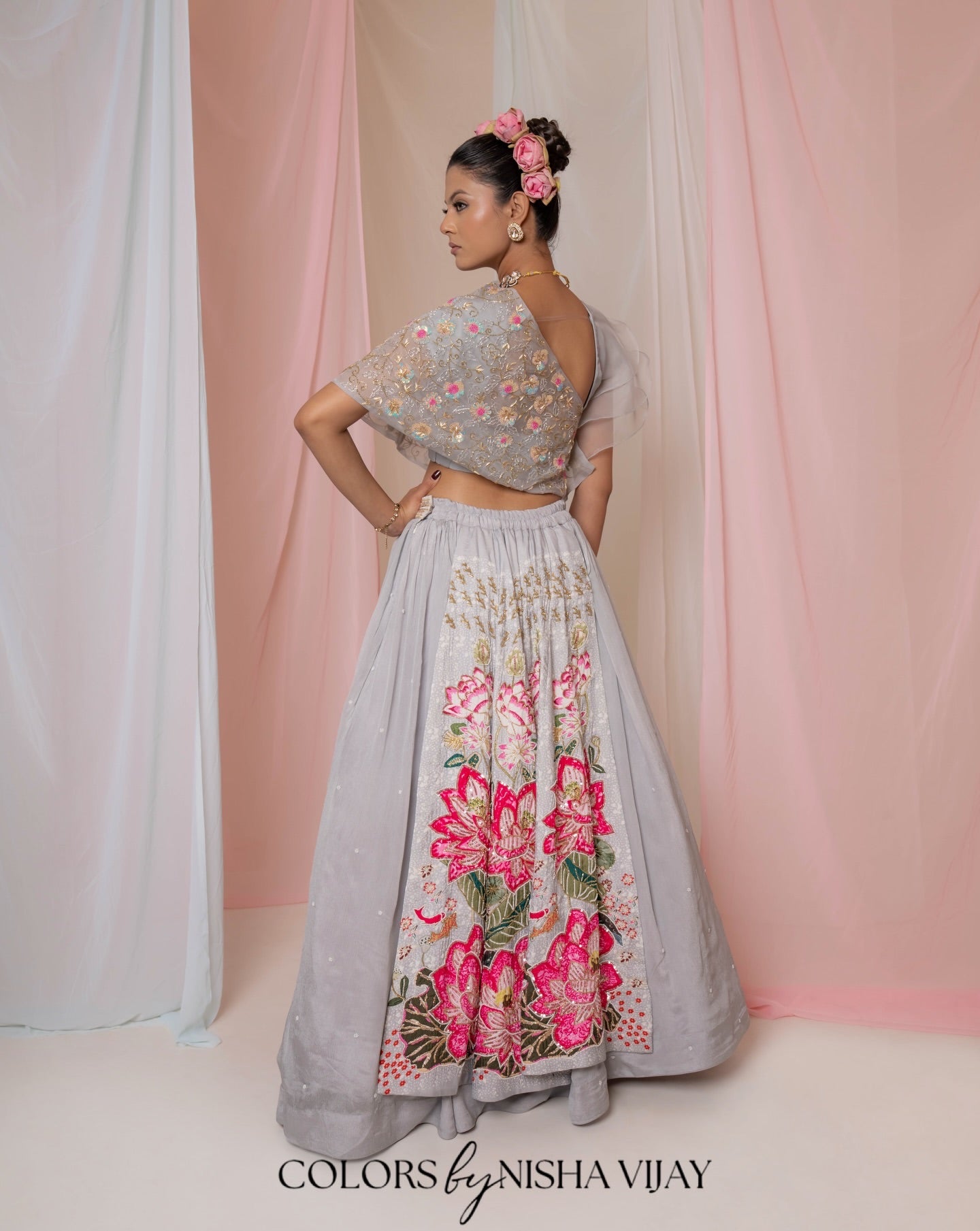 Lotus-print double-layer lehenga with orange cap-style frill blouse
