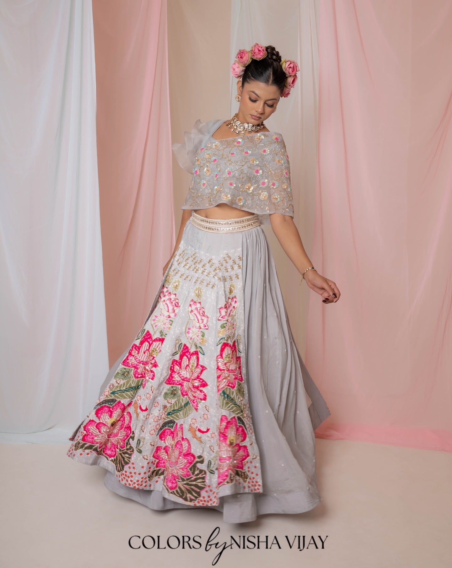 Lotus-print double-layer lehenga with orange cap-style frill blouse