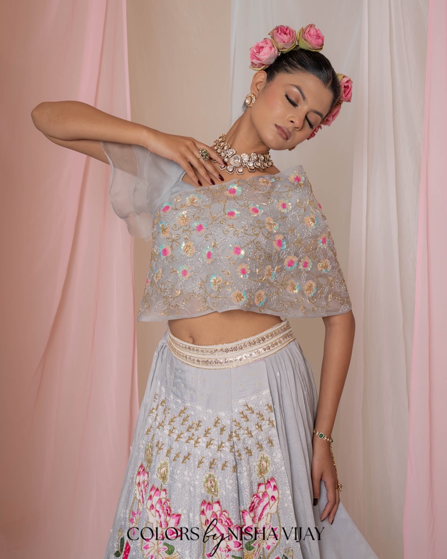 Lotus-print double-layer lehenga with orange cap-style frill blouse