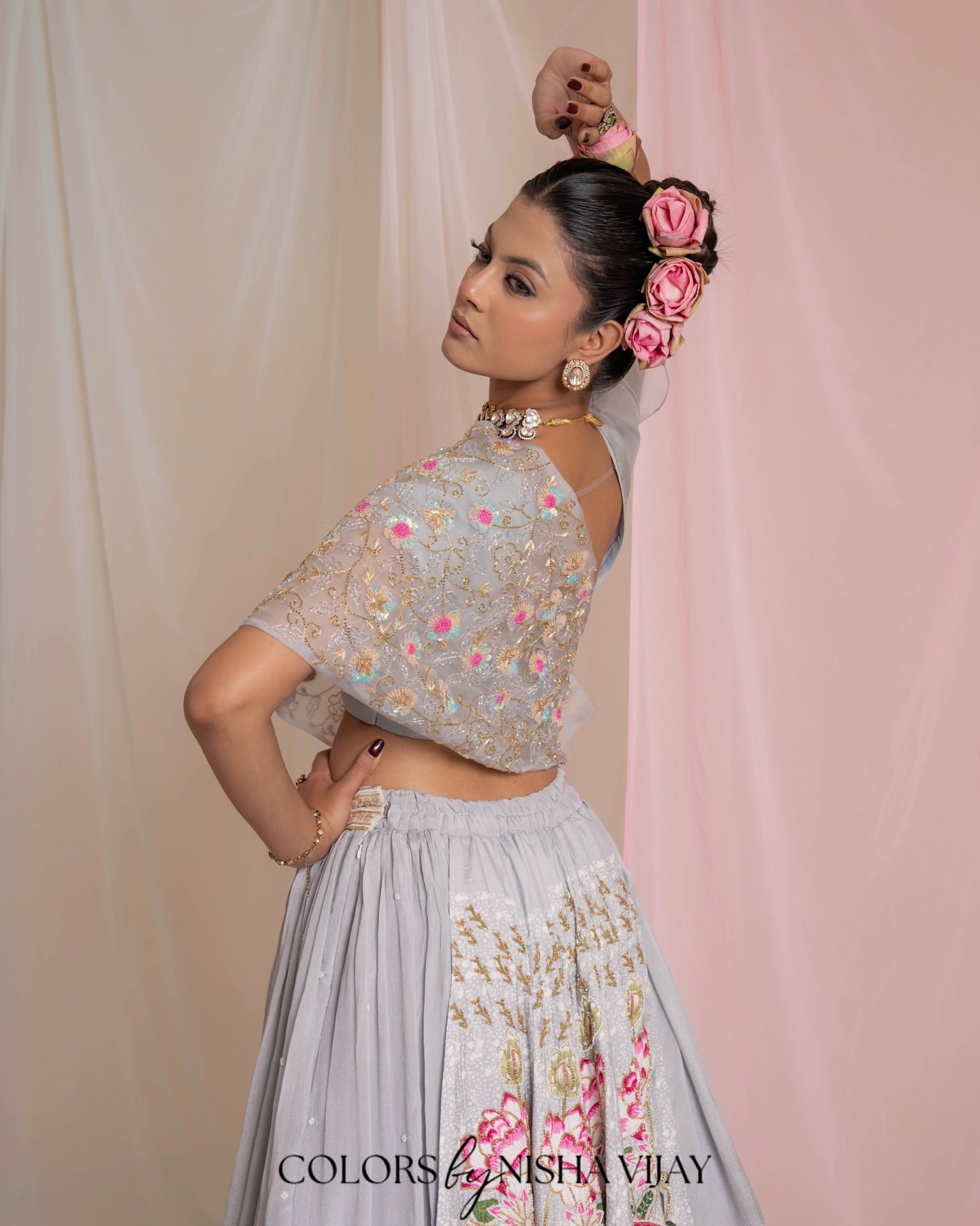 Lotus-print double-layer lehenga with orange cap-style frill blouse
