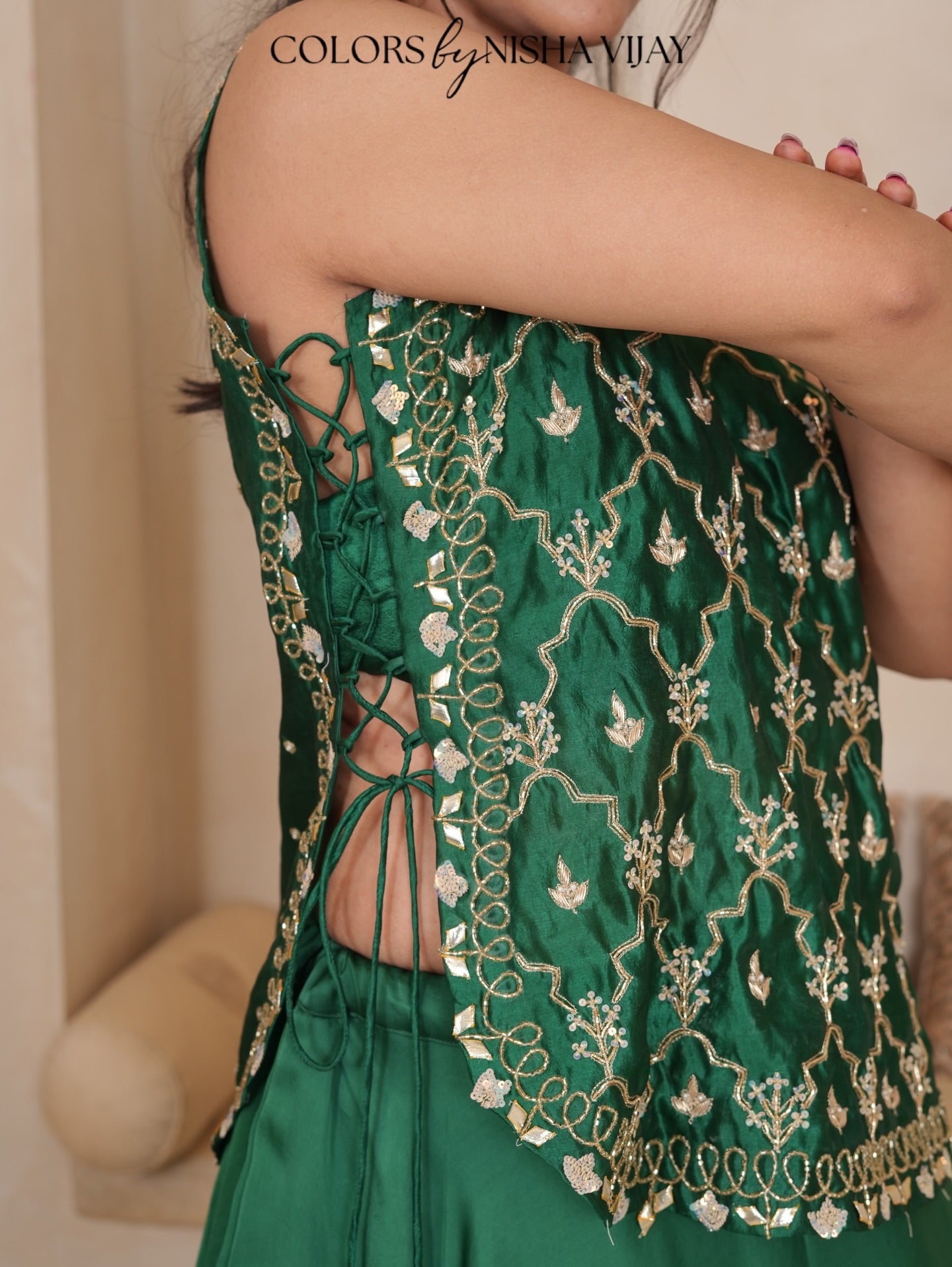 Cap-style blouse; "Add cross" pattern lehenga