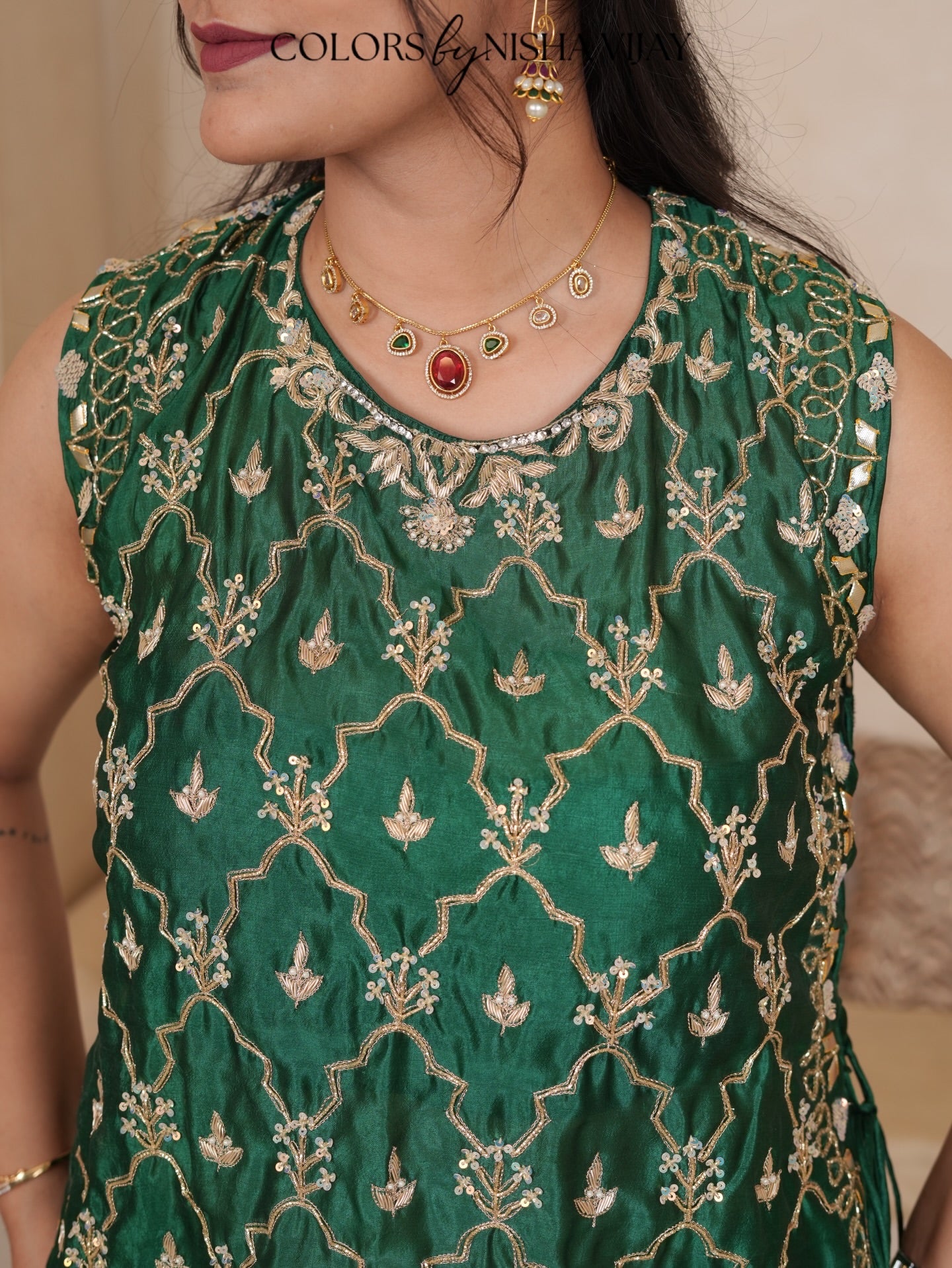 Cap-style blouse; "Add cross" pattern lehenga